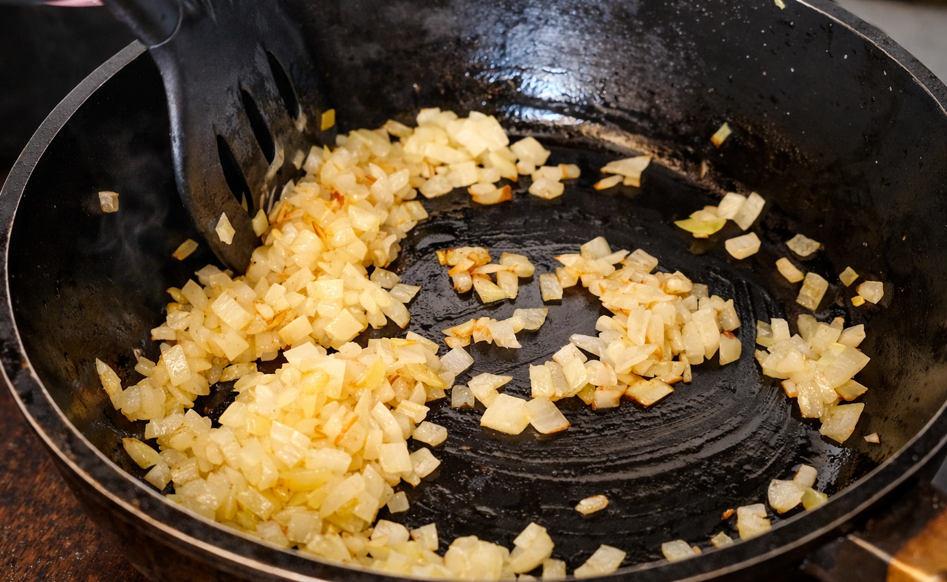 Step 4.1: Finely chop the onion and cook it in a pan until soft and lightly golden