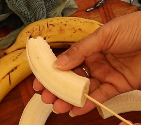 Step 1.1: Peel the bananas and slice each one in half