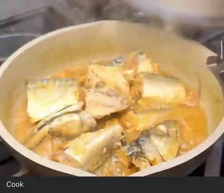Step 1.5: In a pan, add washed Titus fish, water, chopped onions, pepper, curry powder, and other preferred spices