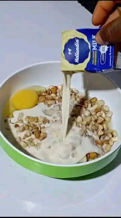 Step 1.3: In a bowl, add little water, properly washed beans, evaporated milk or coconut milk, peeled onion halves, red shombo peppers, and eggs