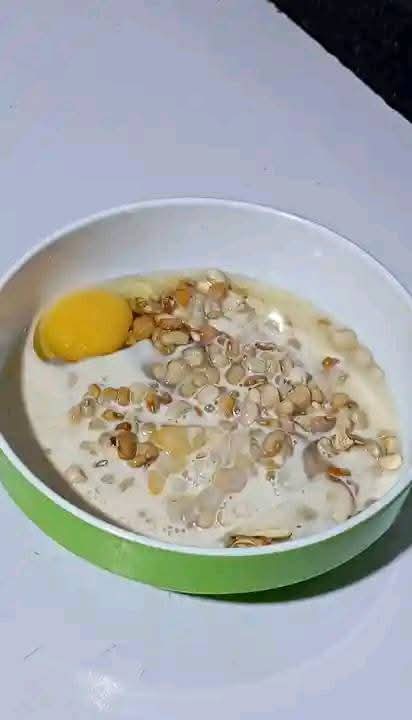 Step 1.4: In a bowl, add little water, properly washed beans, evaporated milk or coconut milk, peeled onion halves, red shombo peppers, and eggs