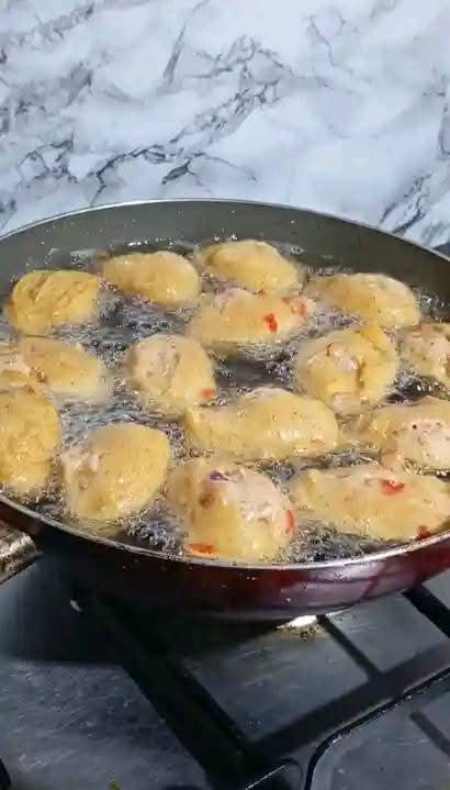 Step 1.2: Heat oil in a pan and scoop the mixture using a deep tablespoon