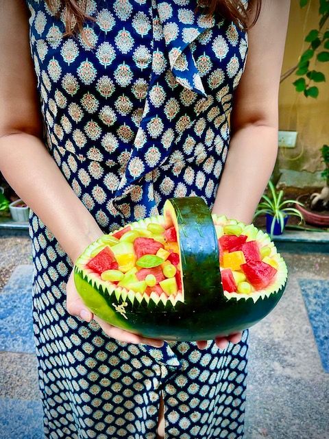 Step 2.1: Add a colourful mix of fruit such as watermelon balls or cubes scooped out from the watermelon, musk melon, kiwi, mango, grapes etc