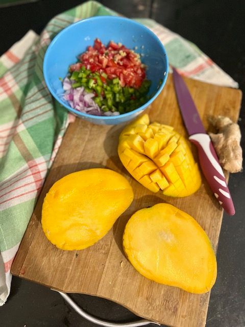 Step 2.1: Using a sharp knife, chop the mango into small, even, bite-sized pieces