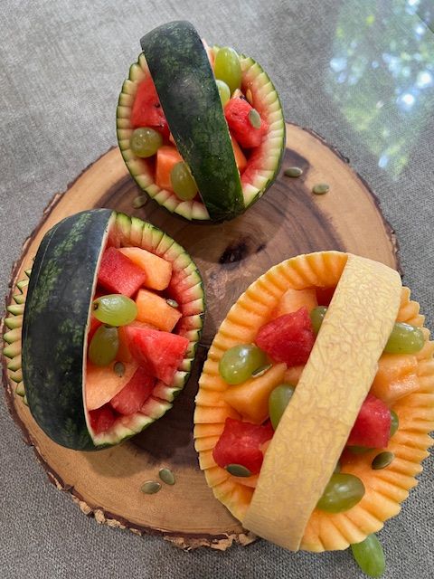Step 2.2: Add a colourful mix of fruit such as watermelon balls or cubes scooped out from the watermelon, musk melon, kiwi, mango, grapes etc