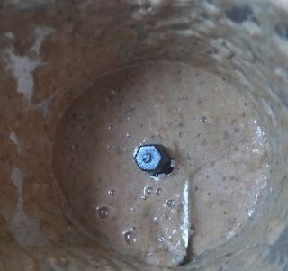 Step 2.1: Add the crushed ingredients to a mixer grinder along with the green chilly, garlic, and tomato