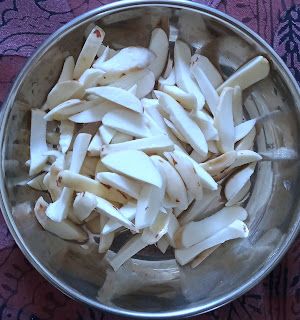 Step 1.1: Clean the jackfruit seeds by peeling the outer cover and the brown part using a knife, then cut into pieces