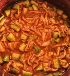Step 2.1: Add 1/2 cup water and bring to a boil, then add brinjal pieces