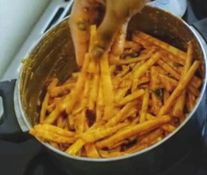Step 1.1: Grab 6-7 batter-coated tapioca strips with your fingers and gently press on one edge to shape them