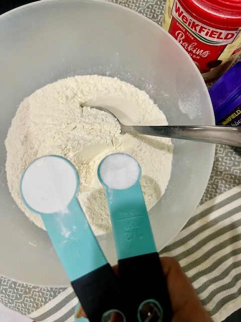 Step 2.1: In a large bowl, sift together the flour, baking powder, baking soda, and salt
