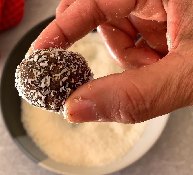 Step 1.1: Roll the balls in shredded coconut for a tasty outer layer