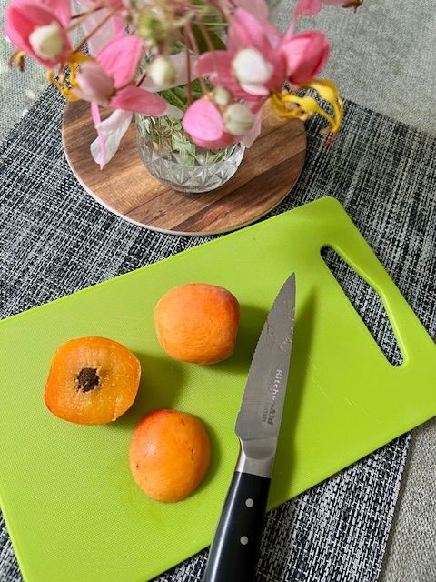 Step 2.1: For the tulips (apricot): Slice the apricot cheeks