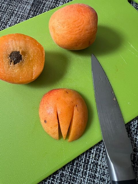 Step 2.2: For the tulips (apricot): Slice the apricot cheeks