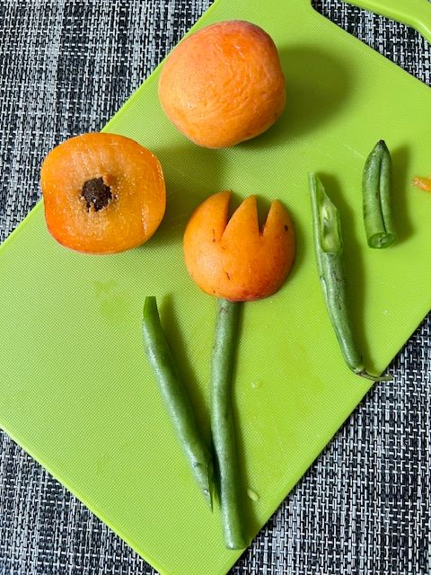 Step 2.4: For the tulips (apricot): Slice the apricot cheeks