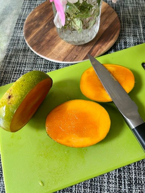 Step 2.1: For the fish (mango): Slice off mango cheeks