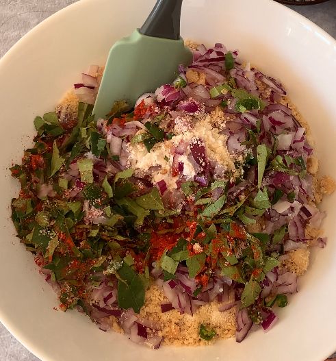 Step 1.1: Combine rice flour, all-purpose flour, semolina, ground peanuts, onions, green chillies, kashmiri red chilli powder, curry leaves and salt in a large mixing bowl