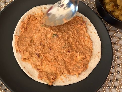 Step 3.1: Spread a spoonful of prepared chutney on the wrap