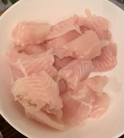 Step 2.1: Place the fish in a mixing bowl