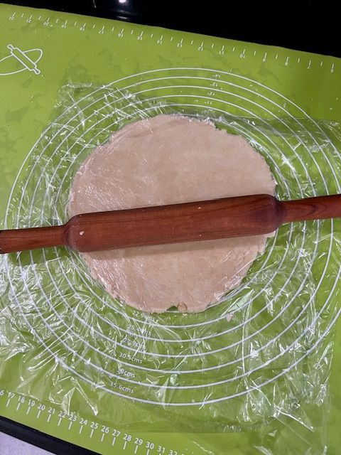 Step 3.1: Roll out the chilled dough into a rough 10–12 inch circle on parchment paper
