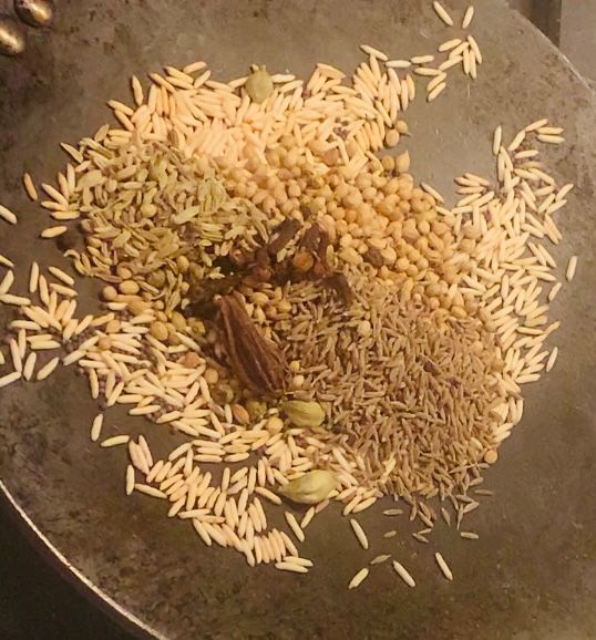 Step 1.1: Add black mustard, coriander, cumin, peppercorns, cardamoms, cloves, and fennel seeds and dry roast them until they release their aroma and turn lightly golden