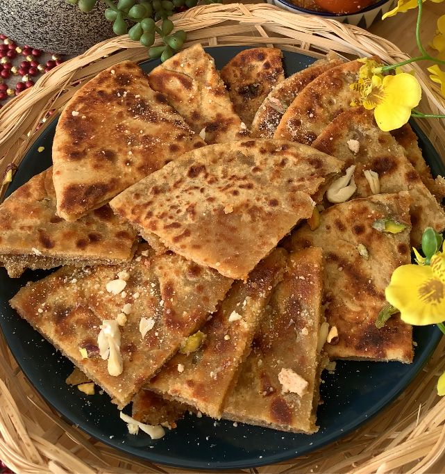 Step 2.1: Cut Gulab Jamun Parathas into quarters, garnish with chopped nuts and enjoy hot!