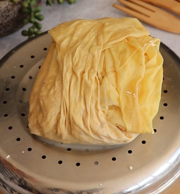 Step 1.1: Mix half teaspoon salt with the curds and wrap it in the cloth