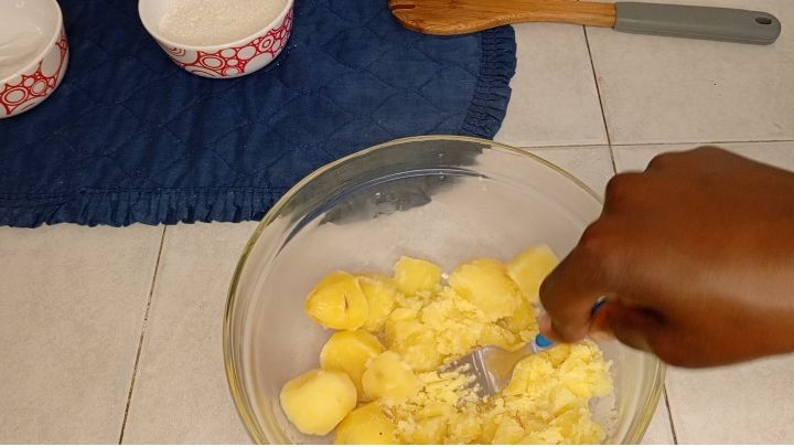 Step 1.1: Once perfectly boiled, don't make it too soft , transfer your potatoes in a clean bowl and mash them using a masher or a fork if you lack masher, to completely crush