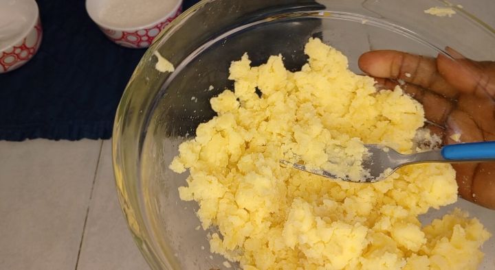 Step 1.2: Once perfectly boiled, don't make it too soft , transfer your potatoes in a clean bowl and mash them using a masher or a fork if you lack masher, to completely crush