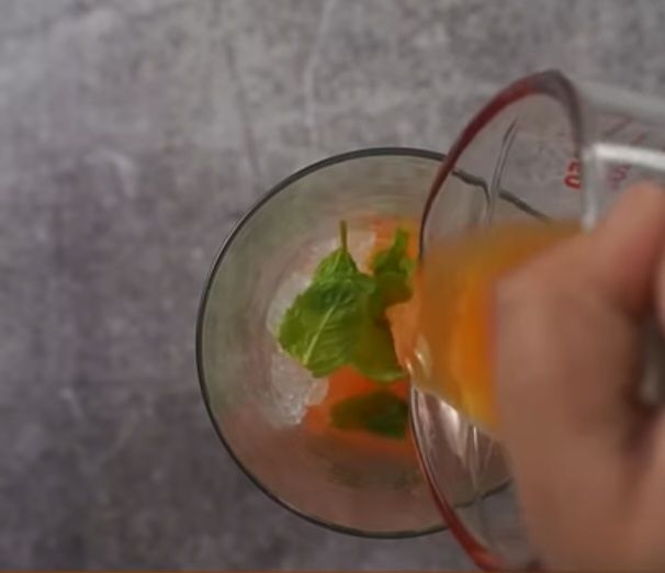 Step 1.2: Add more mint leaves and pour 1/4 cup of orange juice
