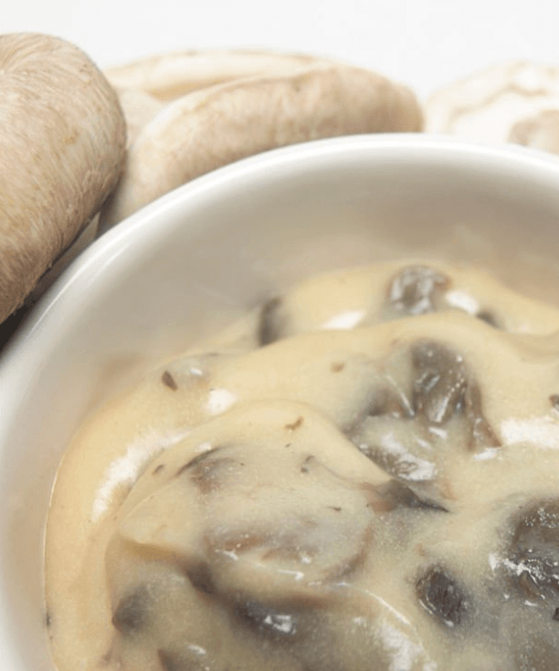 Step 1.1: Pour the cream of mushroom soup evenly over the top