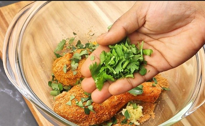 Step 1.3: Add ginger garlic paste, curry leaves, coriander leaves, lemon juice, and red food color (if using)