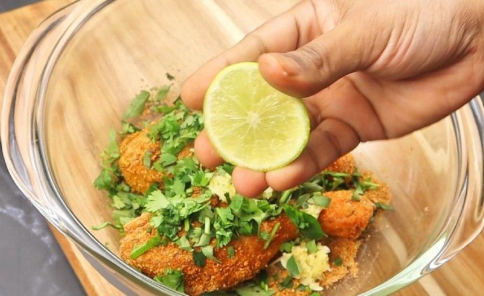 Step 1.4: Add ginger garlic paste, curry leaves, coriander leaves, lemon juice, and red food color (if using)