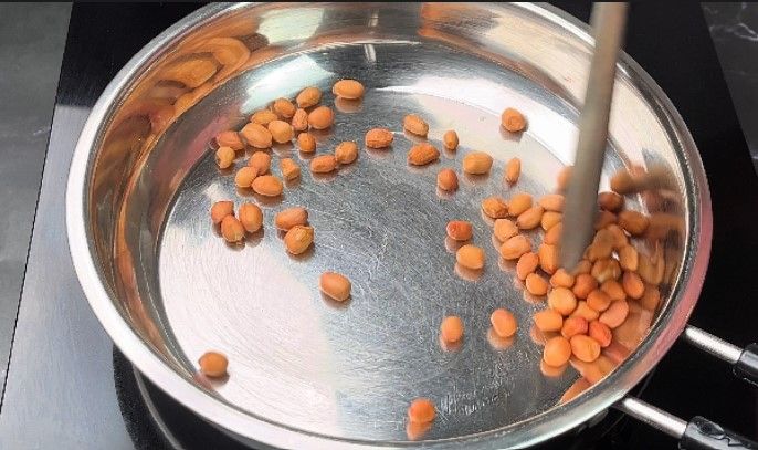 Step 1.3: Roast the peanuts until the skin separates