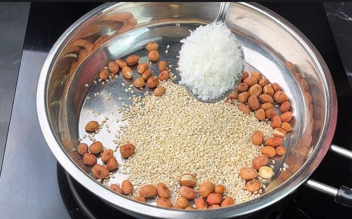 Step 1.2: Roast the sesame and dry coconut on low flame until golden