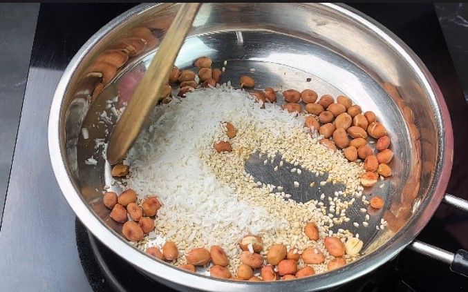 Step 1.3: Roast the sesame and dry coconut on low flame until golden