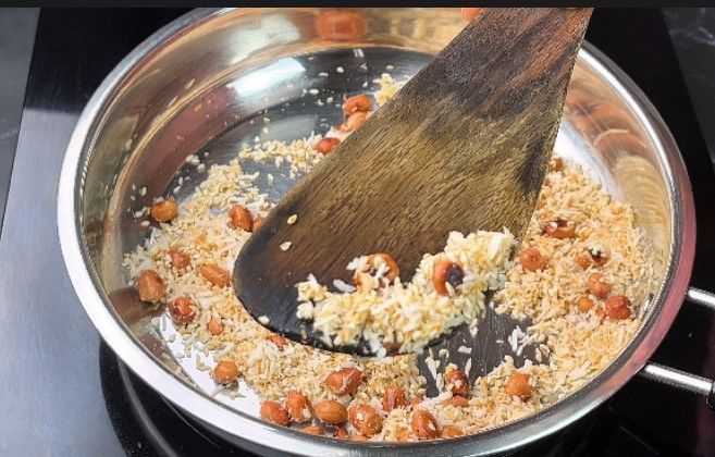 Step 1.4: Roast the sesame and dry coconut on low flame until golden