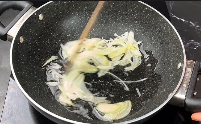 Step 1.3: In a pan, heat oil and sauté the sliced onion and ginger garlic paste