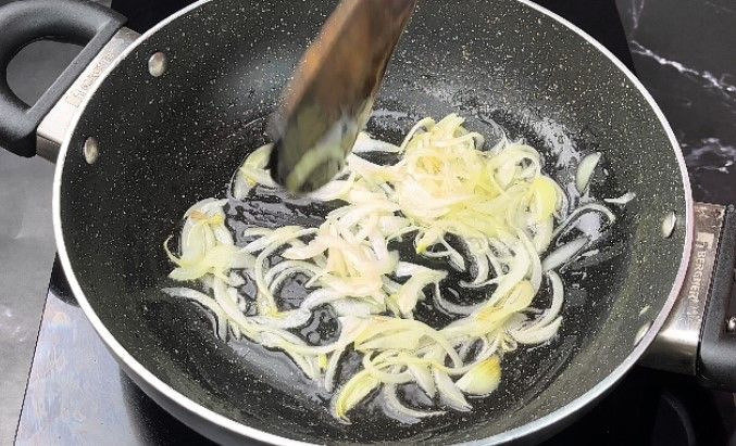 Step 1.4: In a pan, heat oil and sauté the sliced onion and ginger garlic paste