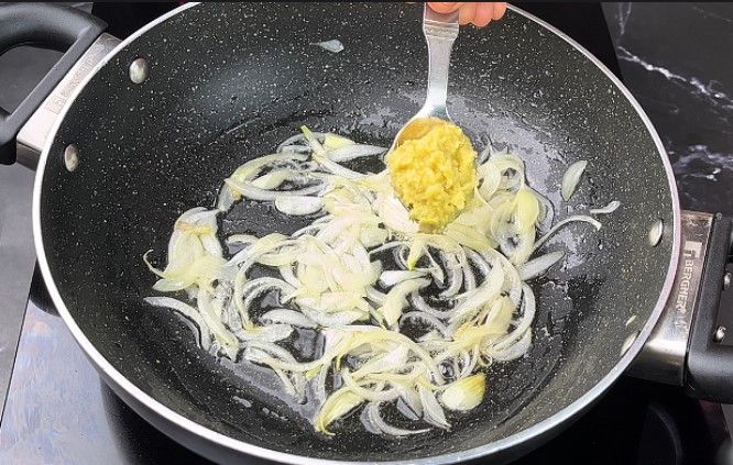 Step 1.5: In a pan, heat oil and sauté the sliced onion and ginger garlic paste