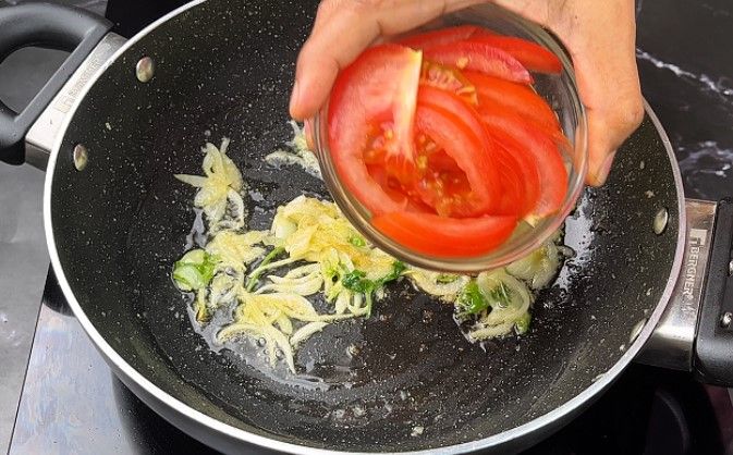 Step 1.3: Add the sliced tomato, Coriander leaves, and chopped mint