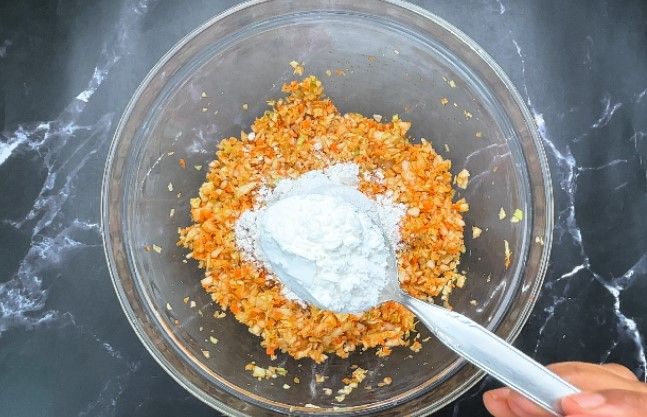 Step 1.2: Add maida (all-purpose flour) and corn flour to the mixture