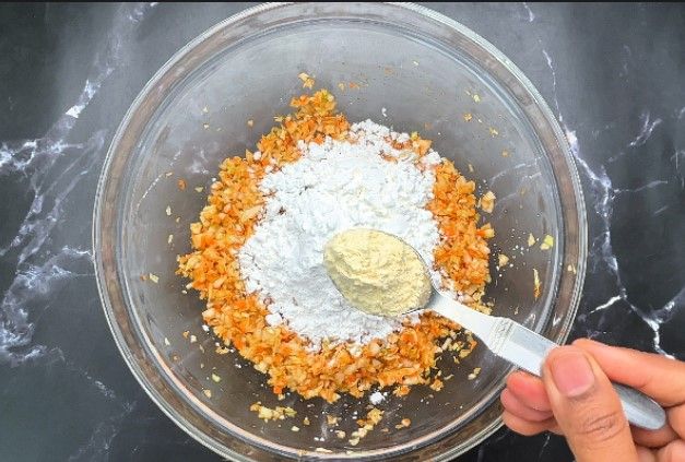 Step 1.3: Add maida (all-purpose flour) and corn flour to the mixture
