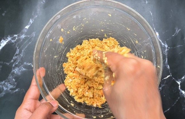 Step 1.1: Lightly grease your palms with oil and shape the mixture into small, uniform balls