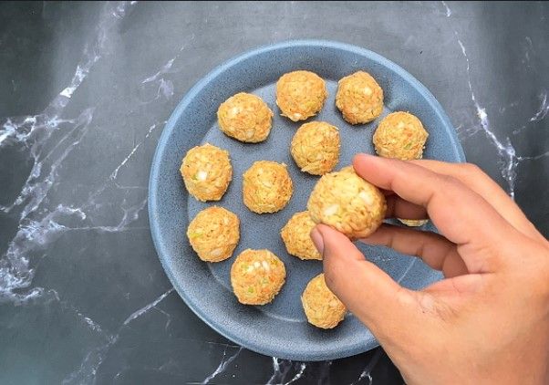 Step 1.3: Lightly grease your palms with oil and shape the mixture into small, uniform balls