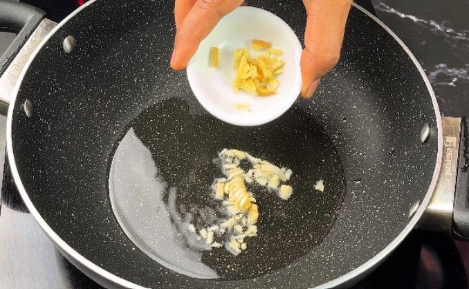 Step 2.3: In a pan, heat a tablespoon of oil