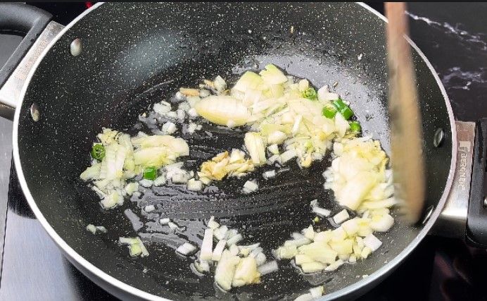 Step 2.2: Add finely chopped onion and capsicum