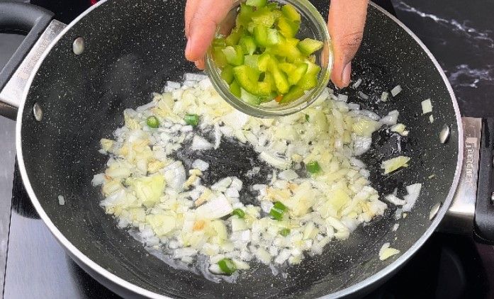Step 2.3: Add finely chopped onion and capsicum
