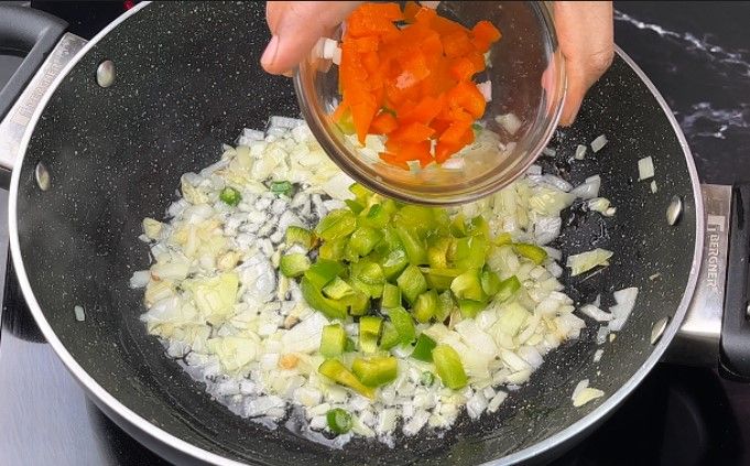 Step 2.4: Add finely chopped onion and capsicum