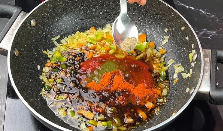 Step 2.7: Add tomato ketchup, vinegar, soy sauce, chili sauce, salt, and red chili powder