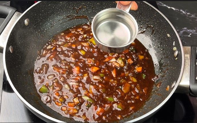 Step 2.1: Add a small amount of water to prevent the sauces from sticking to the pan or burning